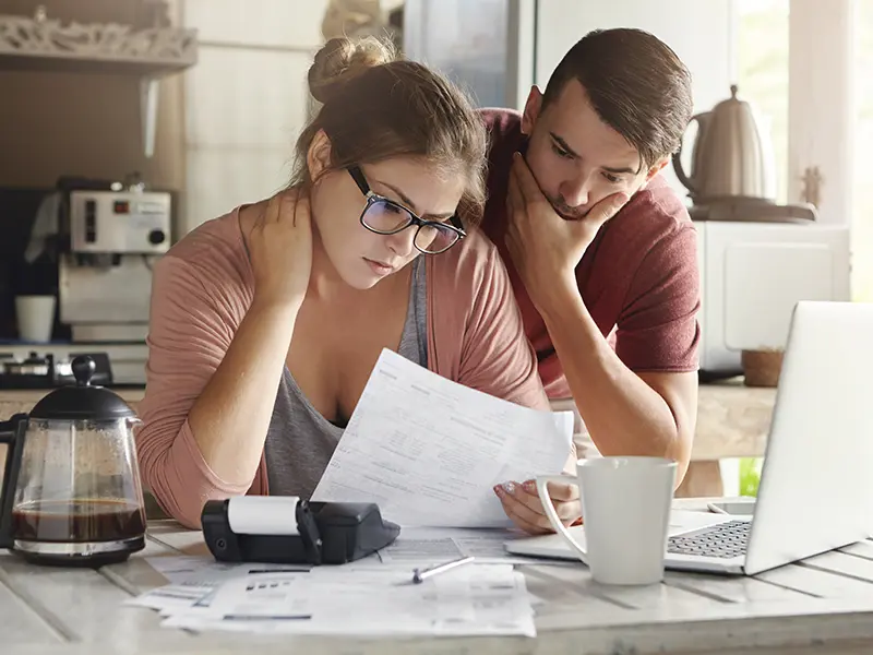 couple banking on laptop