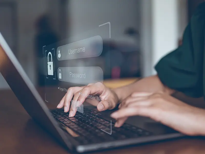 hands on a laptop showing secure login